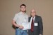 Dr. Nagib Callaos, General Chair, giving Mr. Maik Schumann the best paper award certificate of the session "Design and Modeling in Science, Education, and Technology II." The title of the awarded paper is "Extended Dataflow Model for Automated Parallel Execution of Algorithms."